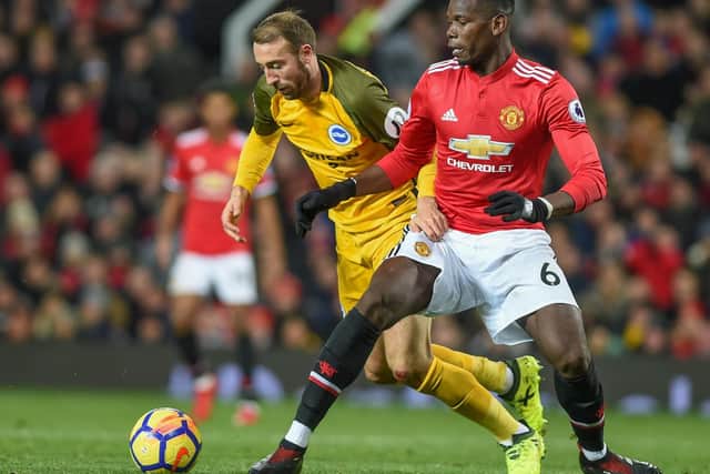 Glenn Murray battles away with Paul Pogba. Picture by Phil Westlake (PW Sporting Photography)