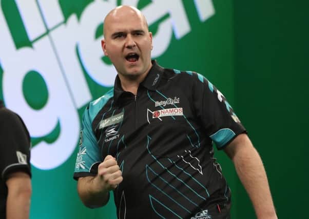 Rob Cross in celebratory mood at the Mr Green Sport Players Championship Finals. Picture courtesy Lawrence Lustig/PDC