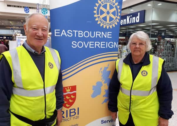 Volunteers from Rotary Club of Eastbourne Sovereign selling tickets for Win A Car SUS-171129-113448001