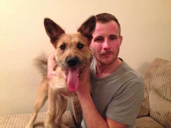 Kelvin Maddox, 30, was attacked by two men who tried to take his dog