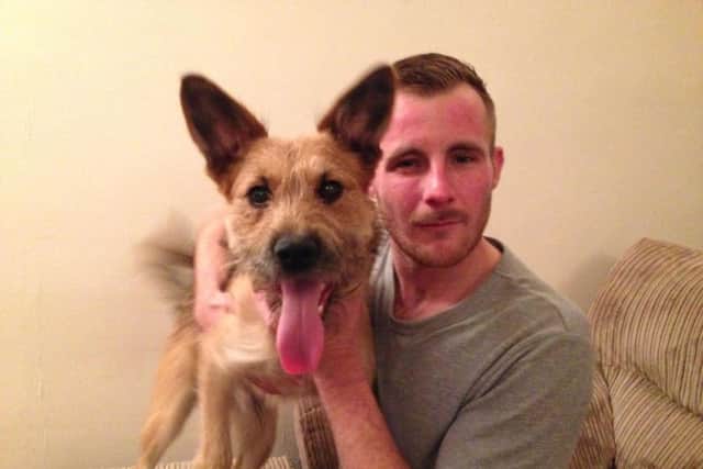 Kelvin Maddox, 30, was attacked by two men who tried to take his dog