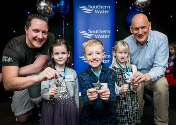West Sussex Achievers of the Year award winners, from left, Beatrice Millard, Liam Hough and Emma Fox, with Duncan Goodhew and Mike Goody. Picture: Ciaran McCrickard Photography