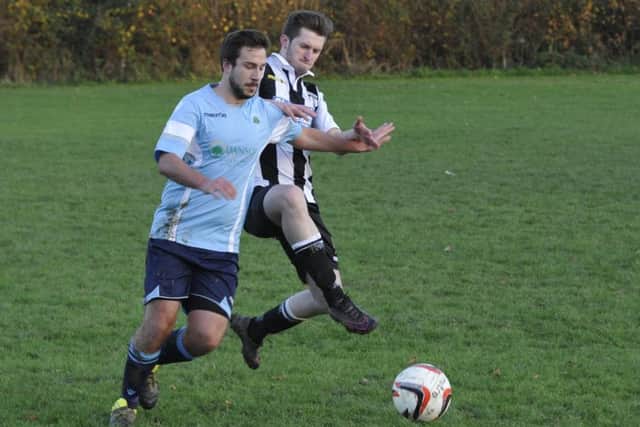 Crowhurst and Robertsbridge compete for the ball.