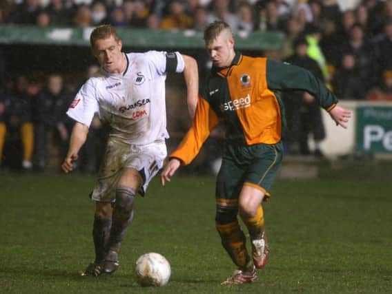 Horsham's Lee Carney in action against Swansea in their FA Cup second round clash at Queen Street. Picture by Steve Cobb