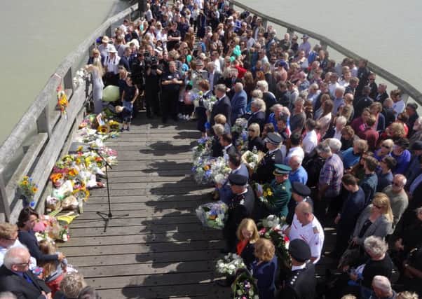 Hundreds of people gathered to pay their respects to the Shoreham Airshow victims, a year after the tragedy