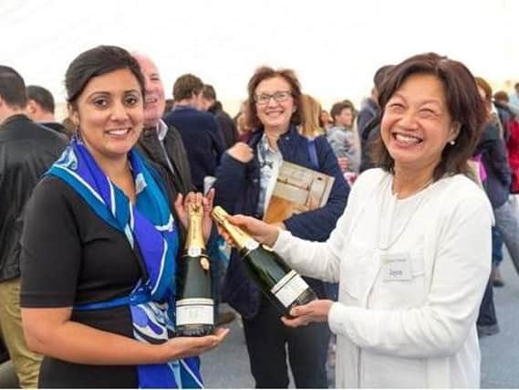 Nus Ghani MP with Joyce Tay founder of Bluebell Vineyard, during a visit
