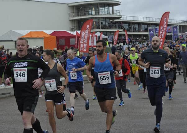 Runners set off at the start of the 2017 Poppy Half Marathon with the De La Warr Pavilion providing the backdrop. Picture by Simon Newstead