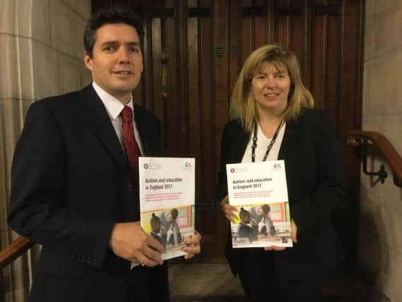 Maria Caulfield MP and Huw Merriman MP in Parliament with a copy of the published report SUS-170712-125501001