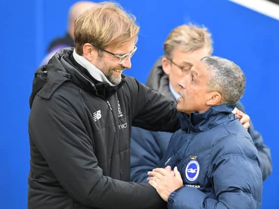 Albion boss Chris Hughton pictured with Liverpool manager Jurgen Klopp before the game. Picture by Phil Westlake (PW Sporting Photography)