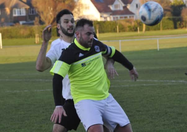 Jack McLean closes down a St Francis Rangers opponent during Bexhill United's 4-2 victory at The Polegrove on Saturday. Pictures by Simon Newstead