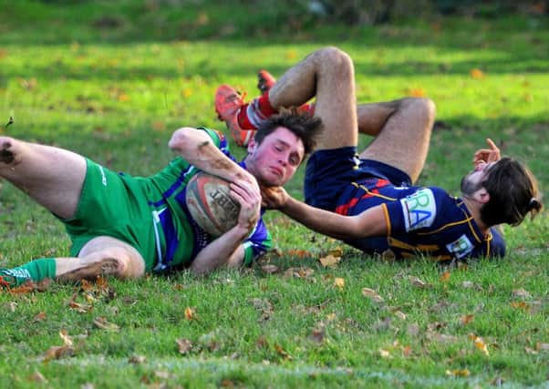 Paddy Burnett is tackled in Bognor's win over Cranleigh / Picture by Steve Robards