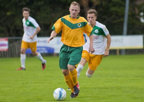 Mark Knee on the ball for Horsham. Picture by Chris Hatton
