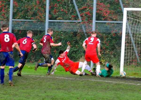 Callum Fewell in action for Bosham against Alfold / Picture by Kate Shemilt