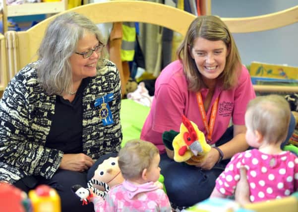 Lady Emma Barnard, High Sheriff of West Sussex, left, meets twins during a visit to the Home-Start Family Group, accompanied by Jo Freeman, play lead Home-Start Arun