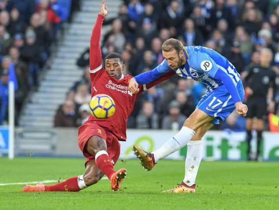 Glenn Murray fires in a shot under pressure from Liverpools Georginio Wijnaldum on Saturday. Picture by Phil Westlake (PW Sporting Photography)