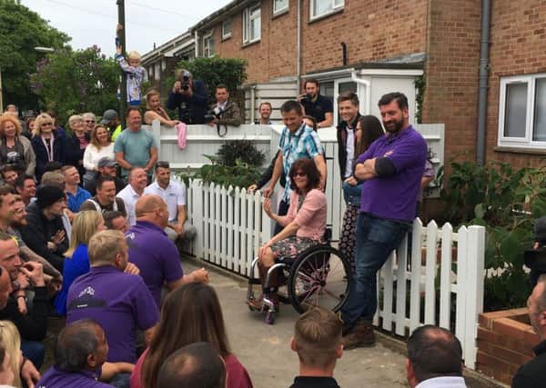 Amanda and her family with Nick Knowles for the big reveal