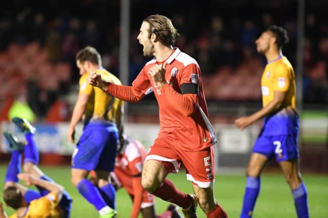 Substitute Joe McNerney celebrates his goal in the clash with Mansfield Town this afternoon. Picture by Phil Westlake (PW Sporting Photography)