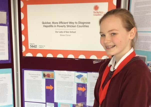 Our Lady of Sion School student Blaise Cloran with her project, Quicker More Efficient Method of Diagnosis for Hepatitis