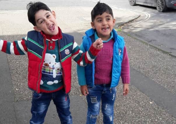 Waleed and Amir. Part of a Syrian family who has settled in Crawley SUS-171112-155555001