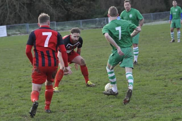 More action from Hollington United's 4-1 victory over Rustington.