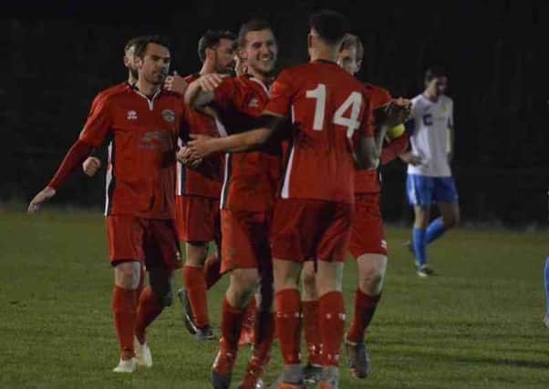 Crawley Down gatwick players celebrate their second goal against Newhaven. Picture by Tony Brown SUS-171212-121000002