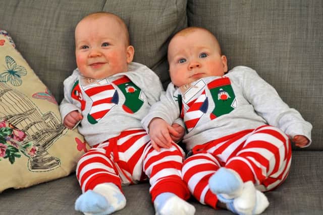 The twins have not stopped smiling since they learned how, according to mum Jo