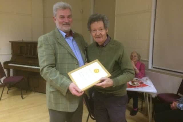 Ronnie Stillwell being presented with his award