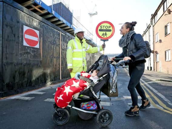 The new lollipop man helping residents cross the road at Circus Street