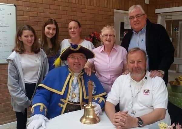 Town crier Bob Smytherman and councillor Sean McDonald visit the Empty Plate Cafe and meet the volunteers