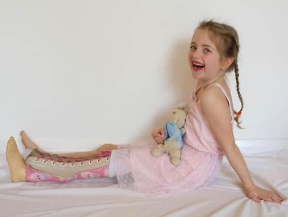 Kyra Warrell, six with her prosthetic which helps her to walk