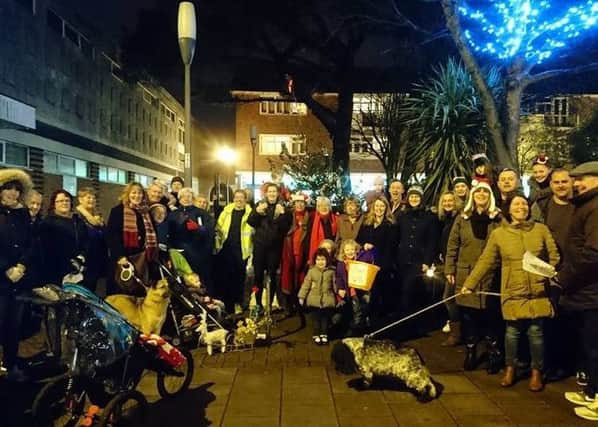 An impromptu community carol singing session in Southwick Square last year