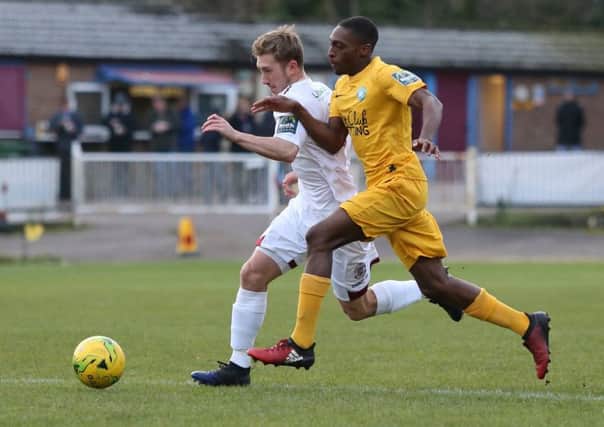 Sam Beale in the thick of the action during Hastings United's victory at home to Whyteleafe last weekend. Picture courtesy Scott White