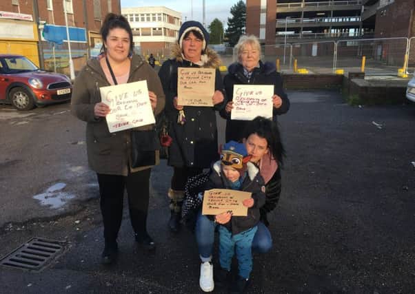 (Left to right) Jade Carroll, 26, Paola Sabino, Ashleigh Dennison, 21, and her son Teddy, two, and Cheryl Hayman, 59. The residents are stood in the car park they want to be reopened for Christmas