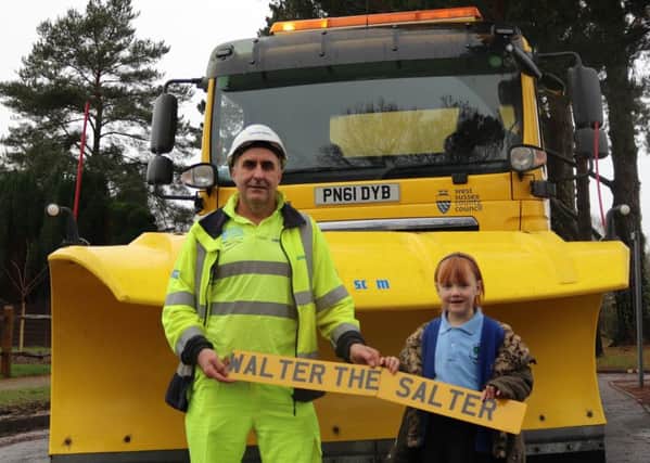 Chloe is pictured with gritter driver Mick Honeywood, from Balfour Beatty Living Places