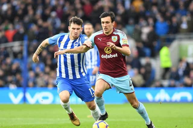 Pascal Gross closes down Burnley midfielder Jack Cork. Picture by Phil Westlake (PW Sporting Photography)