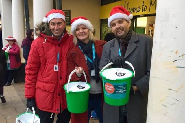 Labour councillor Adrian Morris, Karen Barford and Daniel Yates take part in collecting for BHT