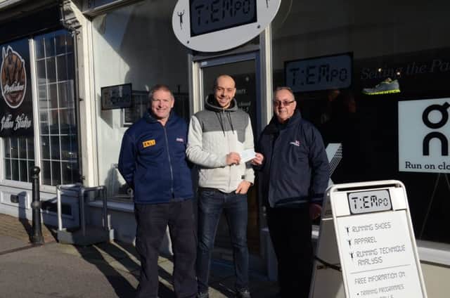 Tempo shop owner Wes Mechen presenting the cheque to Lifeboat Treasurer Keith Stevens and Coxswain Mark Sawyer SUS-171218-095939001
