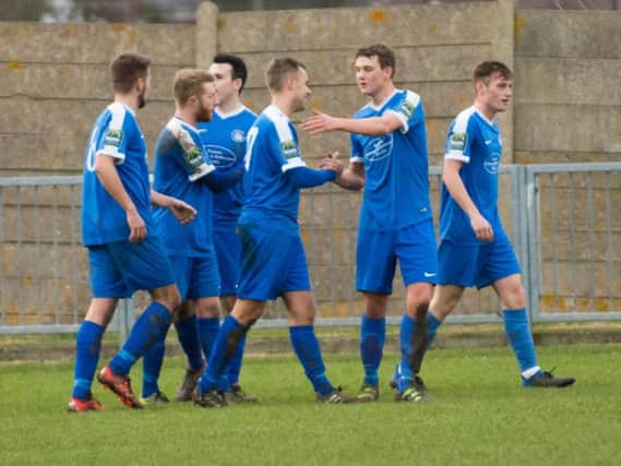 Shoreham players celebrate their goal against Faverhsam. Picture by David Jeffery Photography
