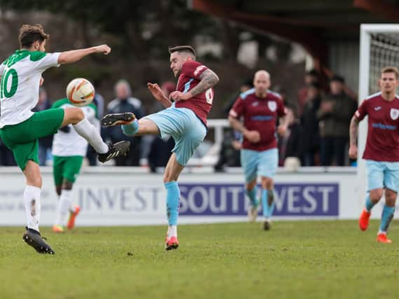 Harvey Whyte challenges for the ball in the Rocks' FA Trophy win at Taunton on Saturday / Picture by Tim Norbury
