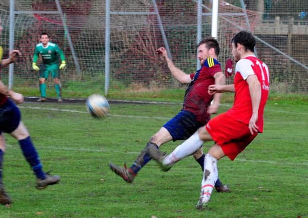 Grant Radmore gave the Robins the lead against Rustington / Picture by Kate Shemilt