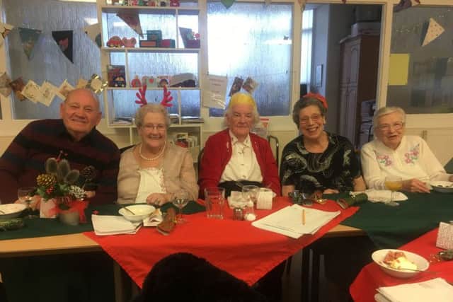 Maureen Smither (second from left), Myrtle Williams and Barbara Shingles with their friends at the Christmas dinner