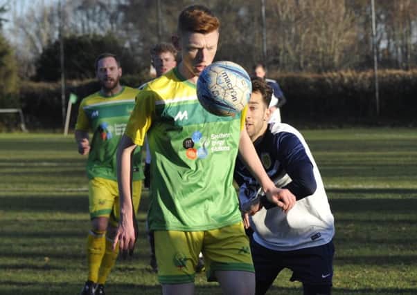 Westfield midfielder Josh Barrett brings the ball under control against Upper Beeding. Pictures by Simon Newstead