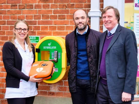 Katie Jackson, of Kamsons Pharmacy, with Steve Monk, GM Monk electrical, and Alan Shuttleworth of Defibrillator Partnership