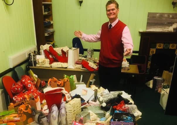 Stephen Lloyd with gifts collected for elderly patients at the DGH
