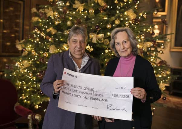 Her Grace Susan Duchess of Richmond, right, presented a cheque for Â£58,733 to Carole Damper, chief executive of the Roberts Centre in Portsmouth    Picture: Nicole Hains