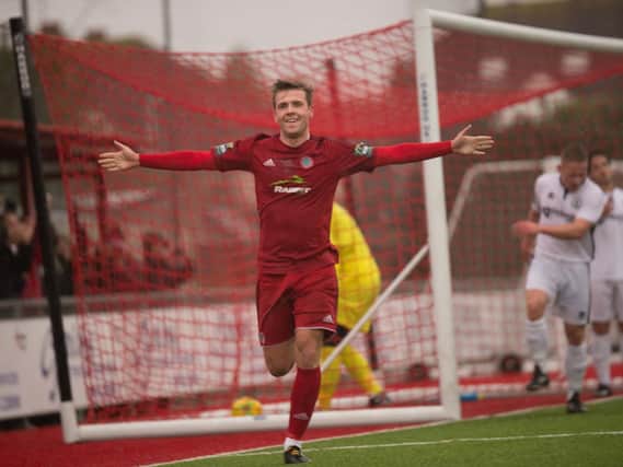 Alfie Young celebrates after firing Worthing ahead this afternoon. Picture by Marcus Hoare.