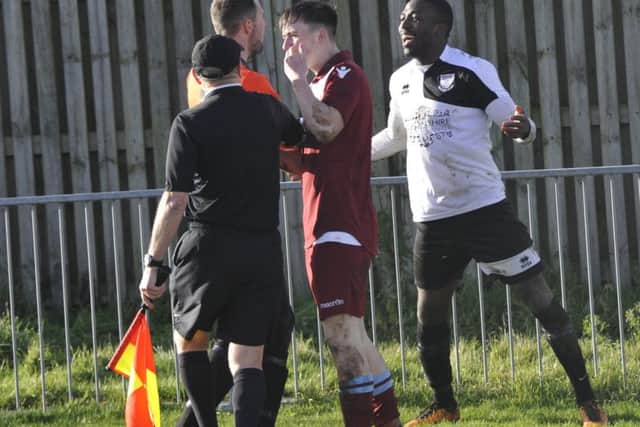 Things get heated following a clash between Little Common full-back Louis Walker and Bexhill United wide player Georges Gouet.