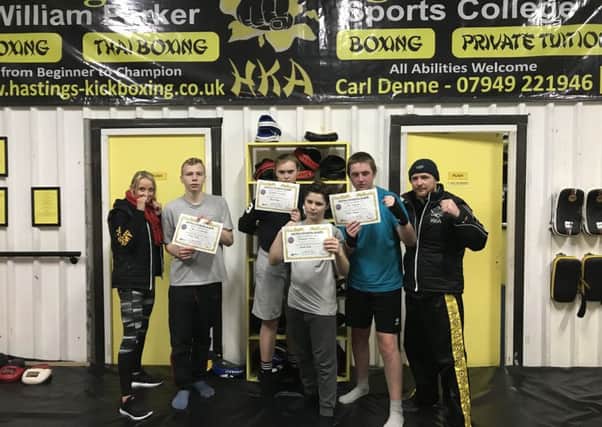 Four New Horizons School pupils after passing a grading at Hastings Kickboxing Academy SUS-180101-124608002