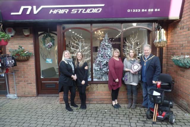 Hand-made Nordic gnomes ... the Mayor of Hailsham, Cllr Nigel Coltman, and staff at NV Hair Studio