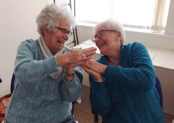 Jean Atkinson, left, and Patricia Naisbit enjoying laughter yoga at Chesham House